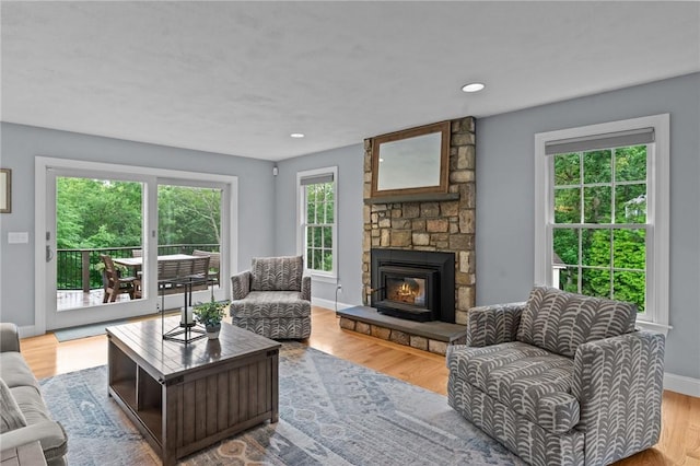 6 Jasons Grant Dr, Cumberland, RI 02864 - living area featuring wood finished floors, a stone fireplace, and recessed lighting