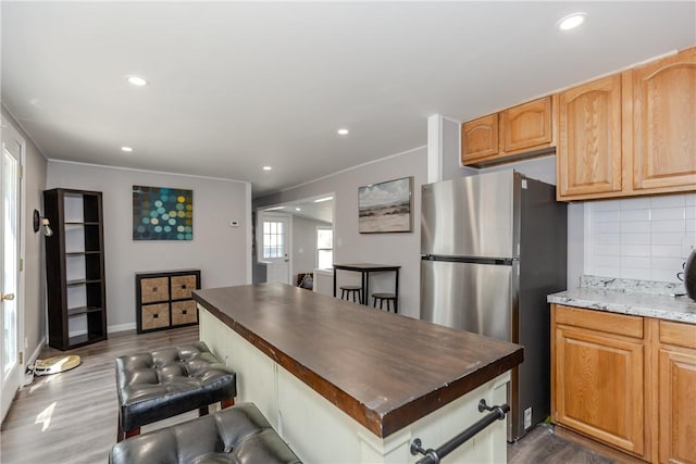 56 Park Ln, Coventry, RI 02816 - kitchen with freestanding refrigerator, dark wood finished floors, decorative backsplash, recessed lighting, and a kitchen island