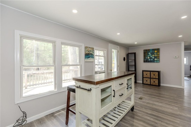 56 Park Ln, Coventry, RI 02816 - kitchen with wood counters, white cabinets, recessed lighting, crown molding, and wood finished floors