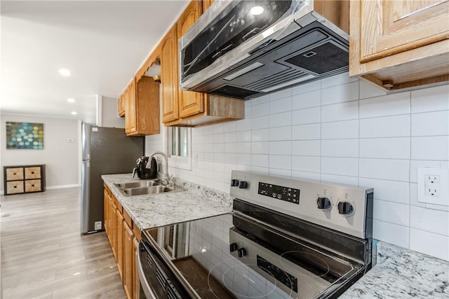56 Park Ln, Coventry, RI 02816 - kitchen featuring appliances with stainless steel finishes, custom exhaust hood, backsplash, and light wood-style flooring
