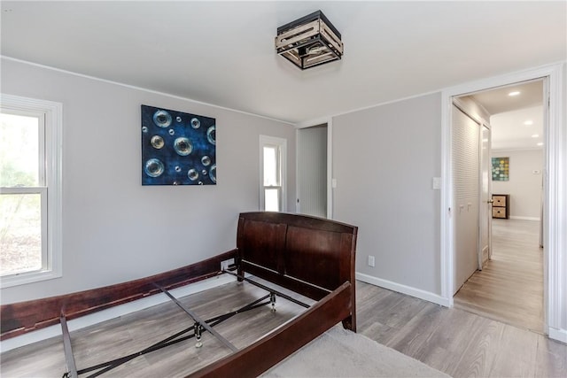 56 Park Ln, Coventry, RI 02816 - bedroom with light wood finished floors, multiple windows, and recessed lighting