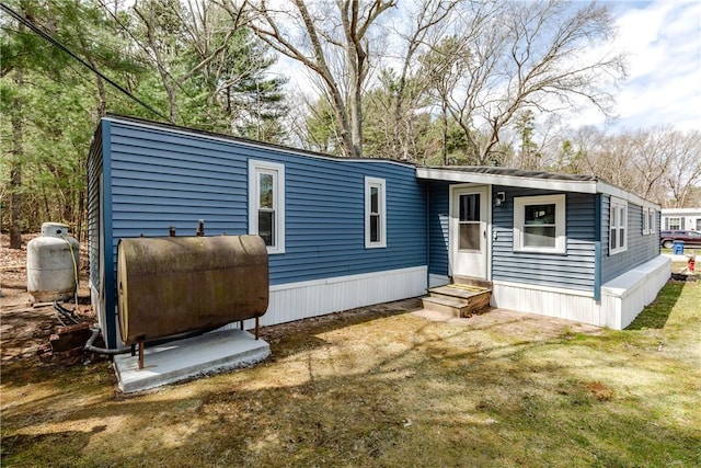 56 Park Ln, Coventry, RI 02816 - view of front of house featuring heating fuel and a front lawn