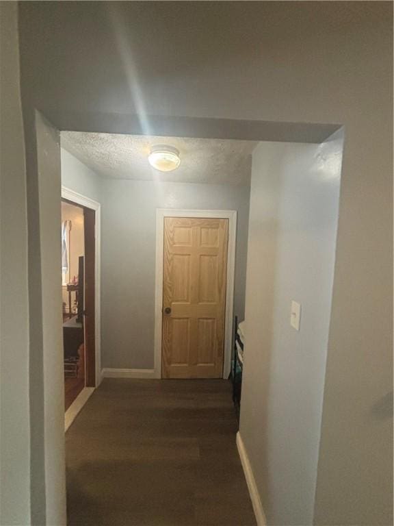 34 Lewis St, Central Falls, RI 02863 - hall featuring dark wood-style floors and baseboards