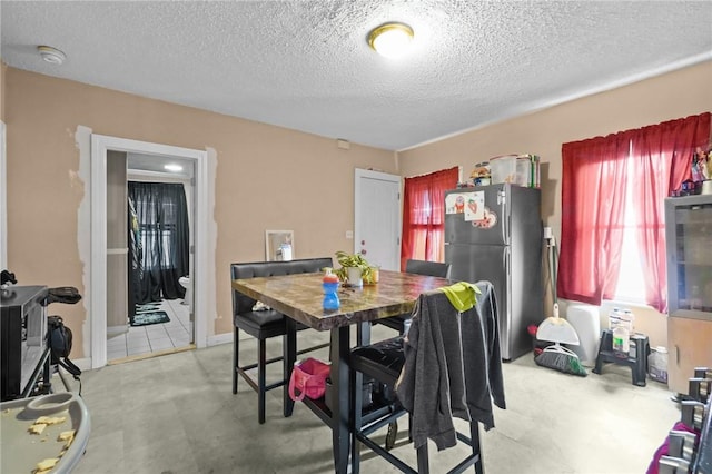 76 Slater St, Pawtucket, RI 02860 - dining area featuring a textured ceiling