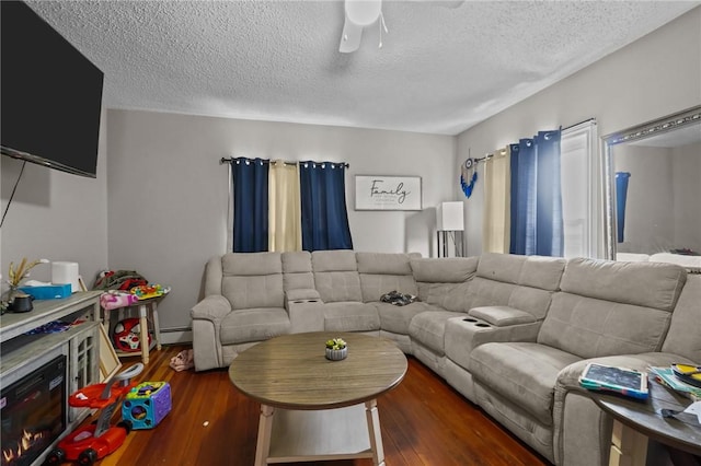 76 Slater St, Pawtucket, RI 02860 - living area with a ceiling fan, wood finished floors, a textured ceiling, and baseboard heating