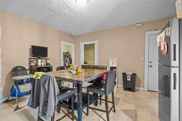 76 Slater St, Pawtucket, RI 02860 - dining space with a textured ceiling and baseboards
