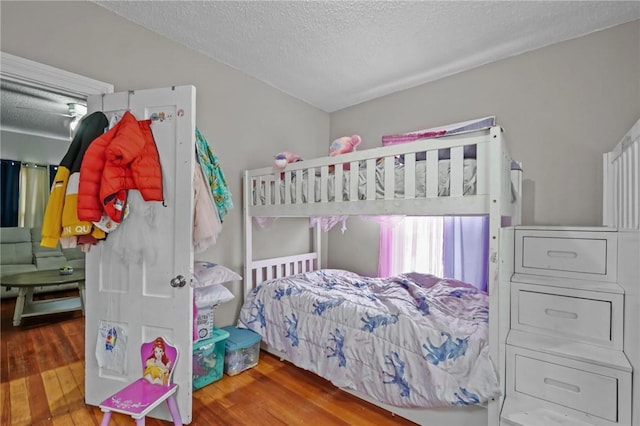 76 Slater St, Pawtucket, RI 02860 - bedroom featuring wood finished floors and a textured ceiling