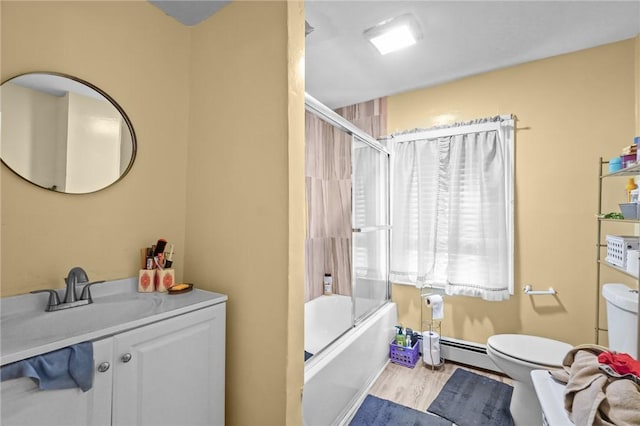 76 Slater St, Pawtucket, RI 02860 - bathroom featuring vanity, wood finished floors, enclosed tub / shower combo, and baseboard heating