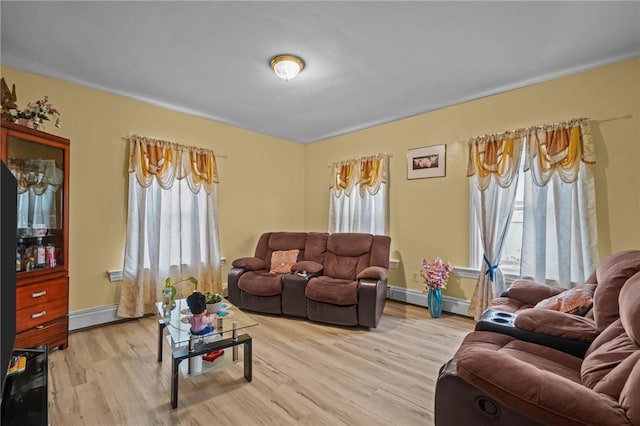76 Slater St, Pawtucket, RI 02860 - living room with wood finished floors and baseboard heating