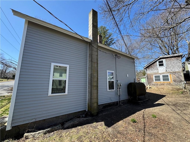 965 Main St, Hopkinton, RI 02832 - view of side of property featuring heating fuel and a chimney