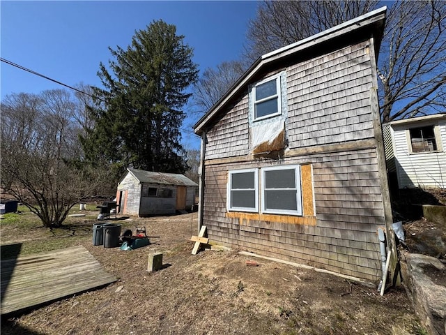 965 Main St, Hopkinton, RI 02832 - view of property exterior featuring a storage unit and a deck