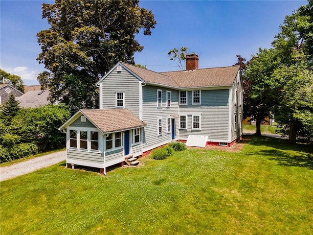 34 Pleasant St, North Kingstown, RI 02852 - back of property with a chimney, entry steps, a lawn, and a shingled roof