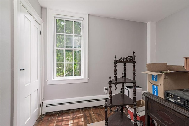 34 Pleasant St, North Kingstown, RI 02852 - office area featuring a baseboard heating unit and wood finished floors