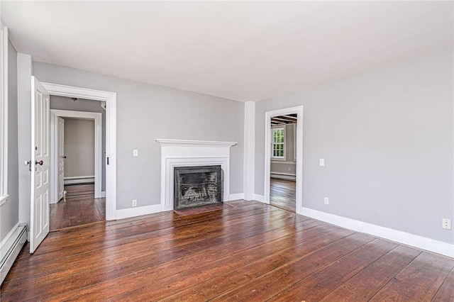 34 Pleasant St, North Kingstown, RI 02852 - unfurnished living room featuring a baseboard radiator, baseboard heating, hardwood / wood-style flooring, and a fireplace with flush hearth