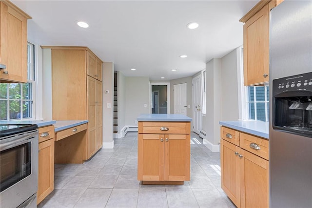 34 Pleasant St, North Kingstown, RI 02852 - kitchen featuring stainless steel appliances, a kitchen island, light tile patterned floors, recessed lighting, and light countertops