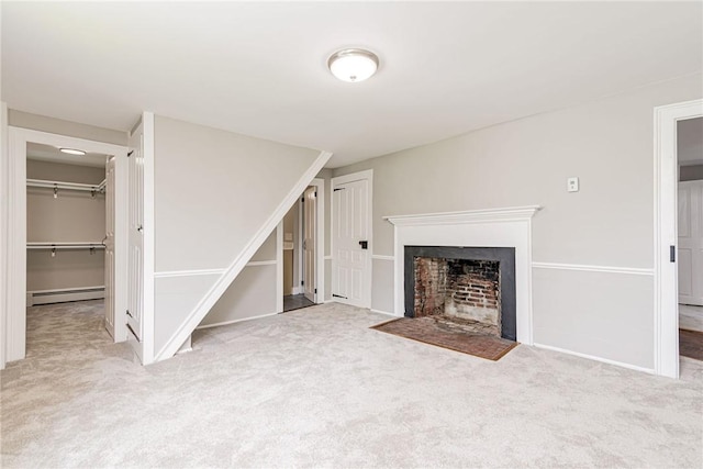 34 Pleasant St, North Kingstown, RI 02852 - unfurnished living room with a baseboard radiator, carpet flooring, and a fireplace with flush hearth