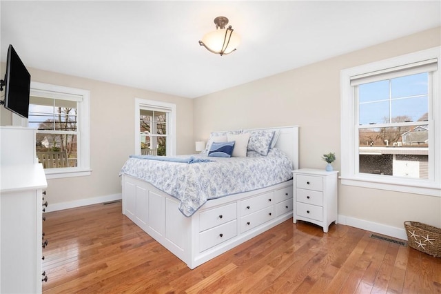 81 S Pier Rd, Narragansett, RI 02882 - bedroom with light wood-style floors and multiple windows