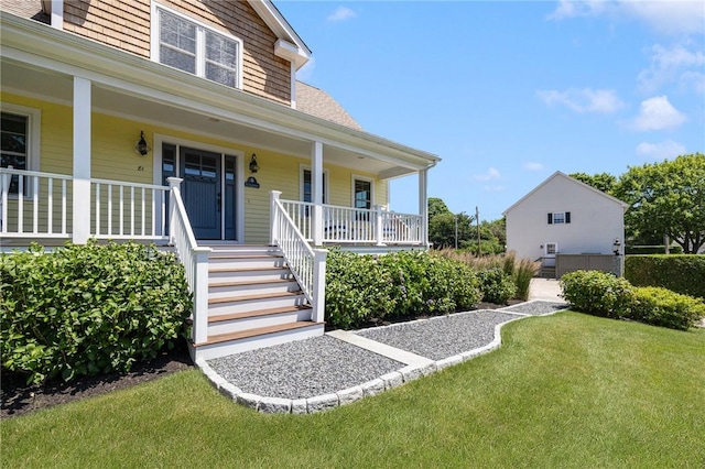 81 S Pier Rd, Narragansett, RI 02882 - view of front of house with a porch and a front yard
