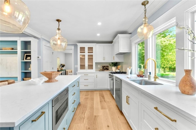 420 Long Hwy, Little Compton, RI 02837 - kitchen featuring appliances with stainless steel finishes, white cabinetry, light wood finished floors, decorative light fixtures, and recessed lighting