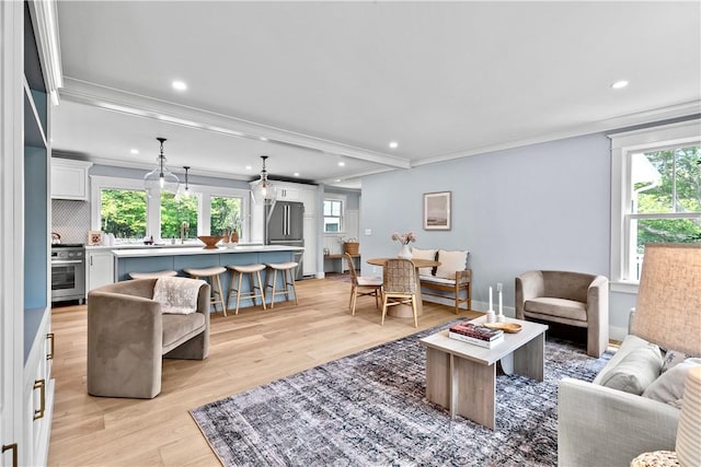 420 Long Hwy, Little Compton, RI 02837 - living area with light wood-style floors, recessed lighting, plenty of natural light, and crown molding