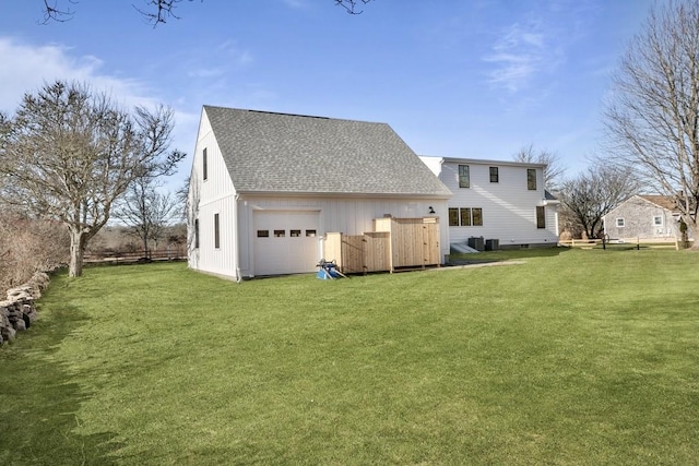 420 Long Hwy, Little Compton, RI 02837 - rear view of property featuring roof with shingles, a garage, and a lawn