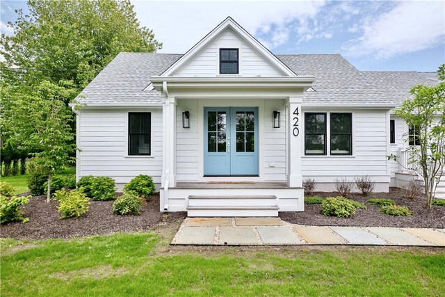 420 Long Hwy, Little Compton, RI 02837 - view of front facade with roof with shingles and french doors