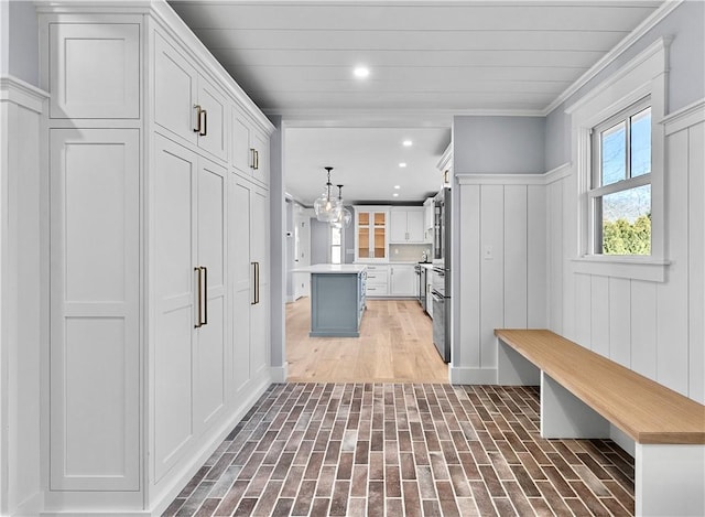 420 Long Hwy, Little Compton, RI 02837 - mudroom featuring brick floors, recessed lighting, a chandelier, and ornamental molding