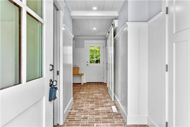 420 Long Hwy, Little Compton, RI 02837 - hallway with brick floors, crown molding, recessed lighting, and a decorative wall