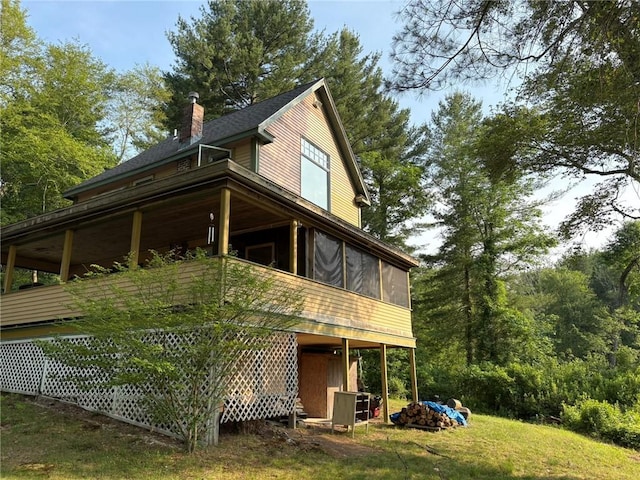 40 Anthony Rd, Foster, RI 02825 - view of side of home featuring a sunroom, a chimney, and a yard