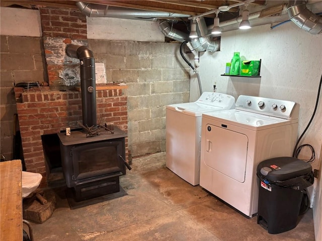 40 Anthony Rd, Foster, RI 02825 - laundry room featuring independent washer and dryer and a wood stove