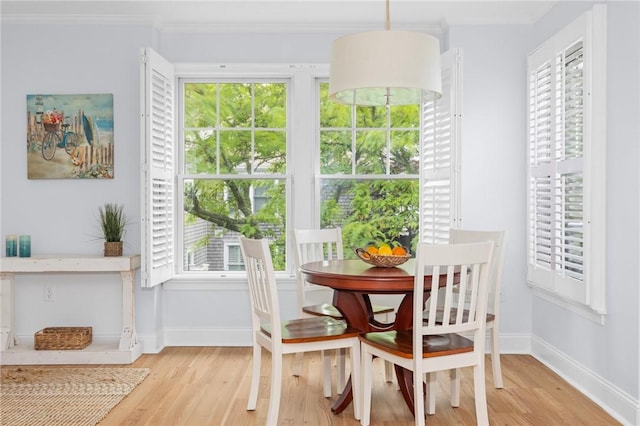 20 Narragansett Ave Unit 404, Narragansett, RI 02882 - dining area featuring light wood-style floors, plenty of natural light, and crown molding