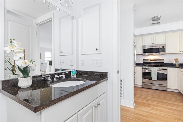 20 Narragansett Ave Unit 404, Narragansett, RI 02882 - bathroom with wood finished floors and vanity