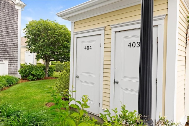 20 Narragansett Ave Unit 404, Narragansett, RI 02882 - view of exterior entry featuring a lawn