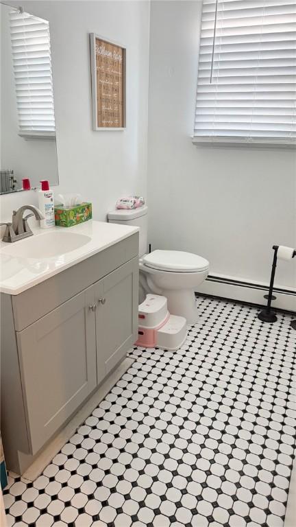 179 Wallace St, Providence, RI 02909 - bathroom featuring vanity, a baseboard radiator, and tile patterned floors