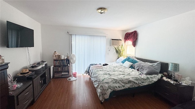 179 Wallace St, Providence, RI 02909 - bedroom with dark wood finished floors and a wall unit AC