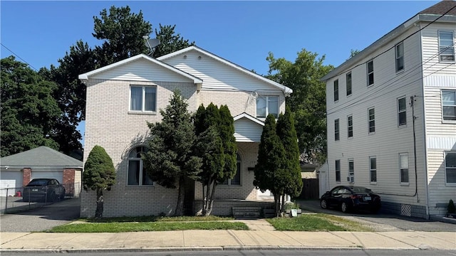 179 Wallace St, Providence, RI 02909 - view of front of property with brick siding and an outdoor structure
