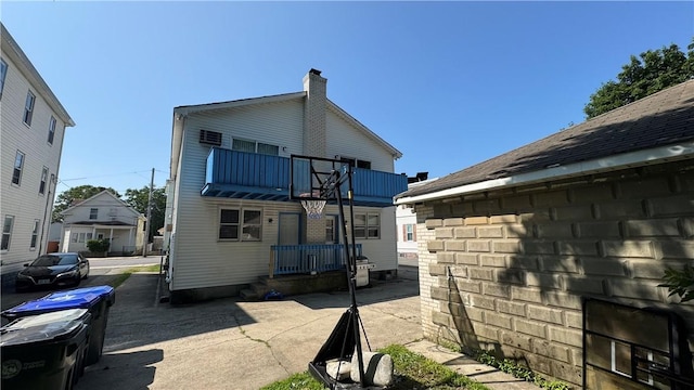 179 Wallace St, Providence, RI 02909 - rear view of property featuring a balcony and a chimney