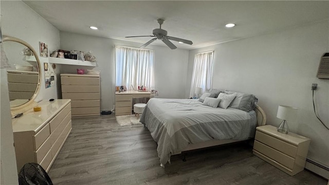 179 Wallace St, Providence, RI 02909 - bedroom with a baseboard radiator, wood finished floors, recessed lighting, and ceiling fan