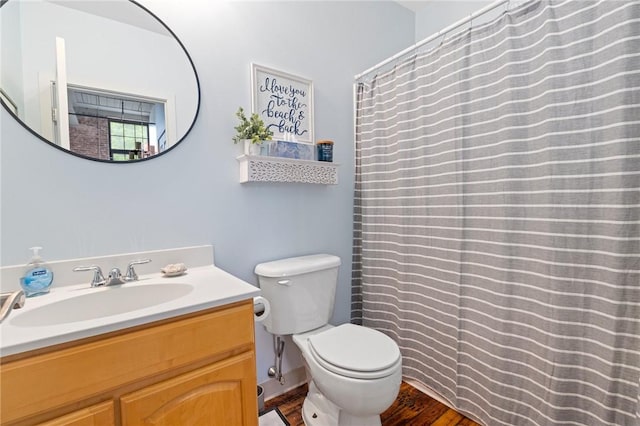 685 Social St Unit 114, Woonsocket, RI 02895 - bathroom with vanity, wood finished floors, and curtained shower
