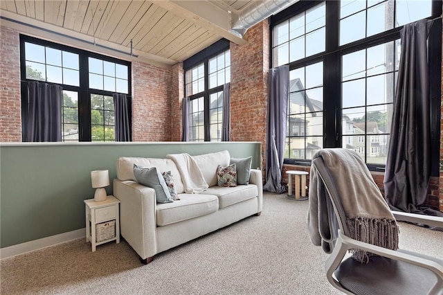 685 Social St Unit 114, Woonsocket, RI 02895 - carpeted office featuring brick wall, a towering ceiling, and wooden ceiling