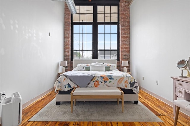 685 Social St Unit 114, Woonsocket, RI 02895 - bedroom with baseboards and wood finished floors