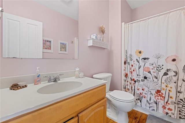 685 Social St Unit 114, Woonsocket, RI 02895 - bathroom with vanity, wood finished floors, and curtained shower