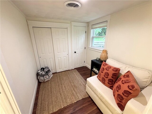 10 Lakeside Dr, Charlestown, RI 02813 - sitting room with dark wood-style flooring and baseboards