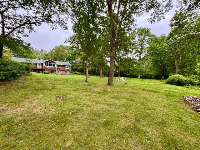 10 Lakeside Dr, Charlestown, RI 02813 - view of grassy yard featuring a wooden deck