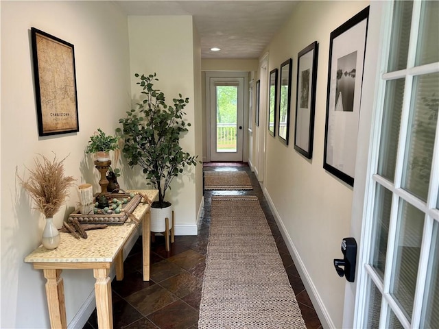 10 Lakeside Dr, Charlestown, RI 02813 - hallway featuring dark stone finish flooring and recessed lighting