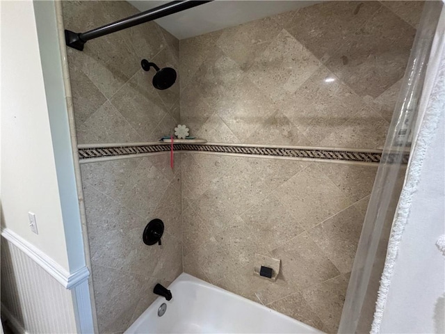 10 Lakeside Dr, Charlestown, RI 02813 - bathroom with washtub / shower combination and a wainscoted wall
