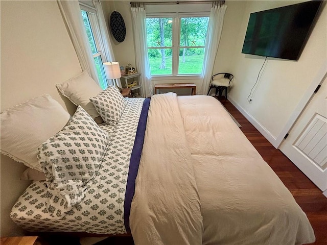 10 Lakeside Dr, Charlestown, RI 02813 - bedroom with dark wood finished floors and multiple windows
