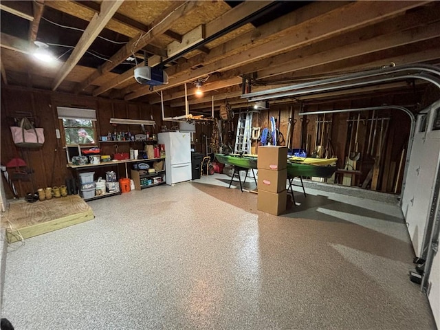 10 Lakeside Dr, Charlestown, RI 02813 - garage with freestanding refrigerator and a garage door opener