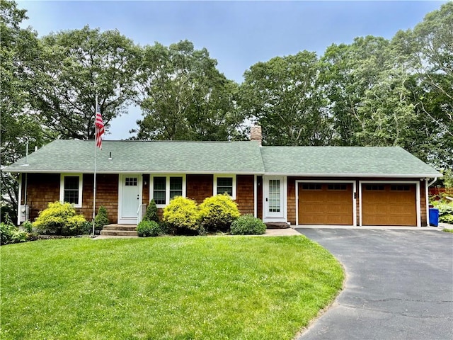 10 Lakeside Dr, Charlestown, RI 02813 - ranch-style home featuring an attached garage, a shingled roof, driveway, and a front lawn