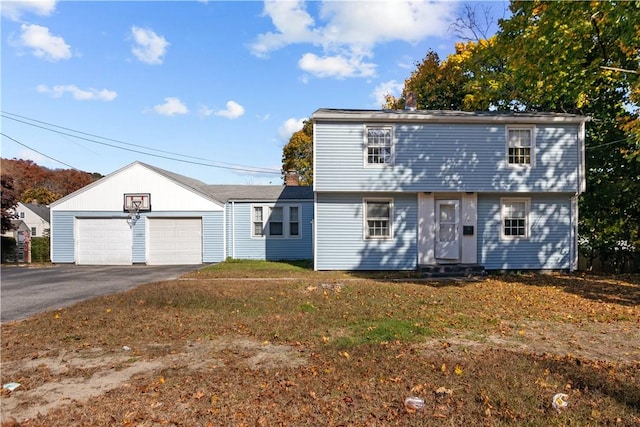 211 Tiogue Ave, Coventry, RI 02816 - colonial house with entry steps, a front yard, and a garage